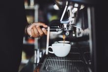 Close-up of Hand Holding Coffee Machine